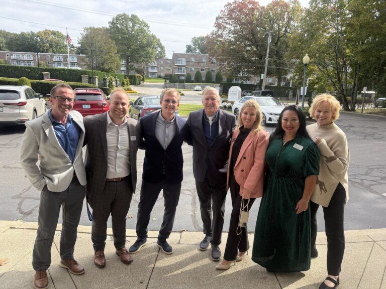 Wingate Living leaders and Cranston Mayor Ken Hopkins outside Wingate Residences at Cranston